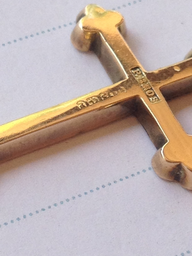 Help reading a worn-out hallmark on a gold cross - www.925-1000.com